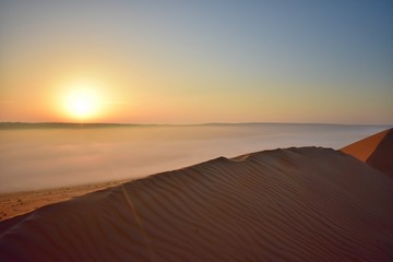 Fototapeta na wymiar Mist in the desert at sunrise