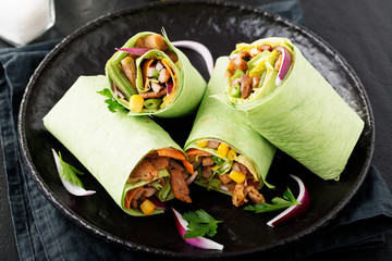 Burritos wraps with meat and vegetables.  Burrito, mexican food.
