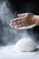 making dough with flour by female hands