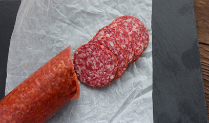 raw smoked sausage cut on the table