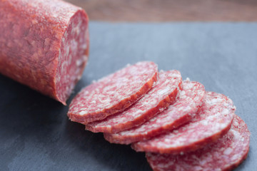 raw smoked sausage cut on the table
