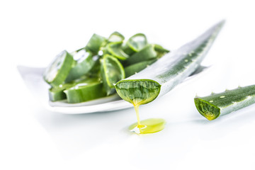 Obraz premium Slices of aloe vera with gel on white background