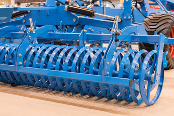 Fototapeta premium Agricultural machinery for soil cultivation. New modern models of agricultural machinery. New agricultural equipment.