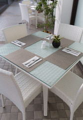 woven furniture design with breakfast covered table cutlery and napkin stylish decoration