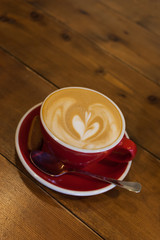 mug from a cappuccino on a wooden table