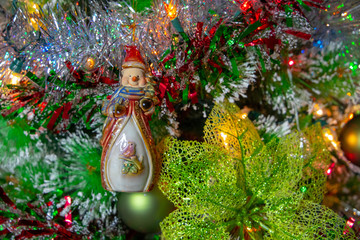 Vintage decorative snowman on christmas tree