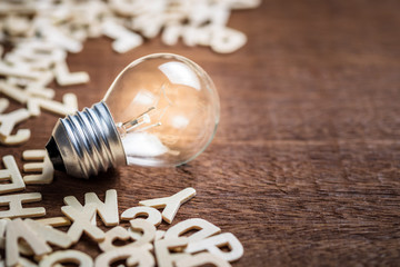 Glowing light bulb and Alphabets