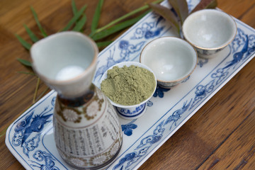 Powdered Green Tea, Matcha Tea and Tea set on wooden