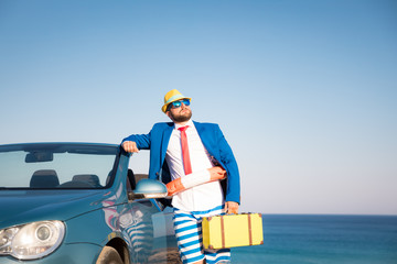 Successful young businessman on a beach