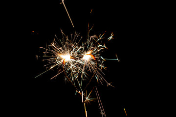 Fire sparklers on black background - Image