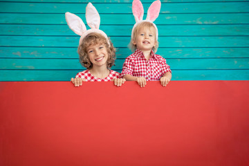 Funny kids wearing Easter bunny