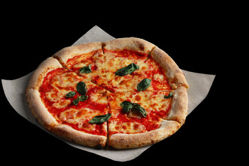 pizza margarita isolated on black. margherita with tomatoes sauce mozzarella cheese and basil leafs