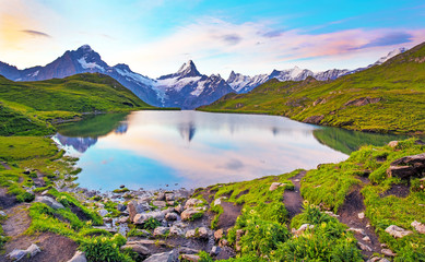 Fantastic landscape at sunrise over the lake in the Swiss Alps, Europe. Wetterhorn, Schreckhorn, Finsteraarhorn et Bachsee. ( relaxation, harmony, anti-stress - concept).