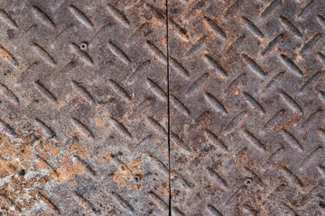 Rusty steel plate texture background. Background of metal diamond plate in grungy.