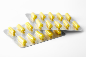 Aluminium blister pack of pills. The capsules are packaged in blisters, isolated on a white...