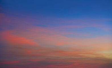 Naklejka na ściany i meble Sunset clouds in orange and blue