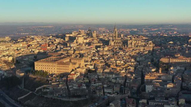 Aerial view of cityscape of Toledo at sunrise, historic center of city, cathedral Santa Iglesia Catedral Primada de Toledo - landscape panorama of Castilla&ndash;La Mancha from above, Spain, Europe
