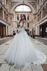 Beautiful delicate young woman, sexy bride in luxurious wedding dress