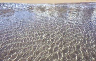 Clear transparent beach water shore