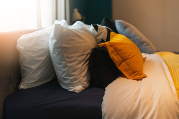 Bed maid-up with clean white pillows and bed sheets in beauty bedroom. Close-up. interior background