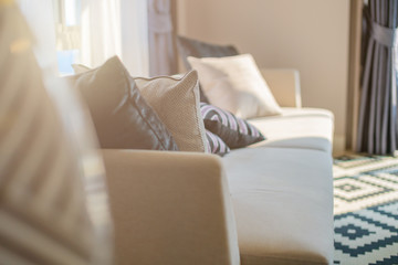 contemporary interior of Living room with part of sofa in sunny day and white curtain interior background concept