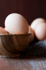Eggs in wooden bowl and bird net
