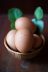 Eggs in wooden bowl