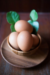 Eggs in wooden bowl