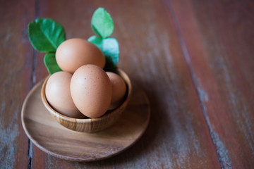 Eggs in wooden bowl