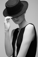 Girl with black vintage hat fashion posing model in studio beautiful young woman girl with perfect skin