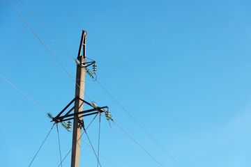 View of electrics, electric lines on the background of blue sky and good weather.