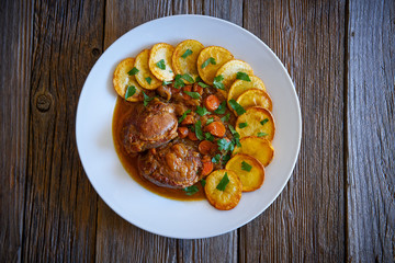 pig cheek recipe on wooden table