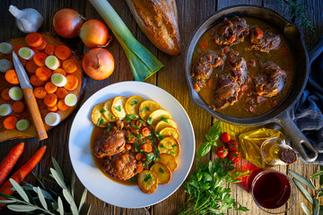 pig cheek recipe on wooden table