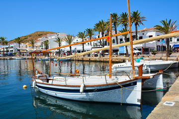 spanish fishing boats in the harbour of fornells, spain