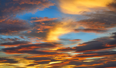 Sunset sky clouds in orange and blue