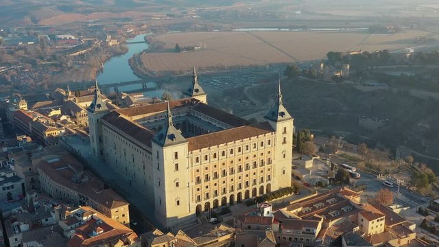 Aerial view of cityscape of Toledo at sunrise, historic center of city, castle Alcazar de Toledo - landscape panorama of Castilla&ndash;La Mancha from above, Spain, Europe