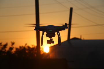 silhouette of drone in sunset