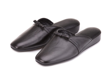 Home slippers isolate on a white background. Homemade leather slippers. Fashion slippers for home.