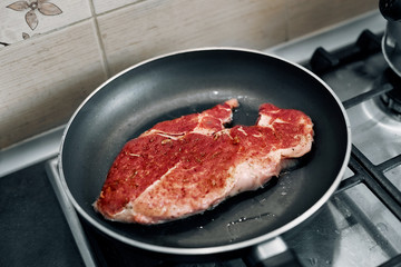 juicy grilled steaks in a frying pan
