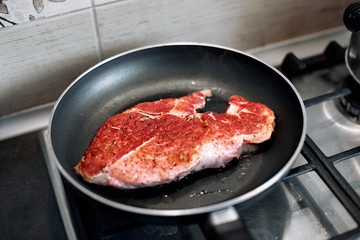 juicy grilled steaks in a frying pan