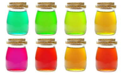 colorful bottles of oil isolated on a white background