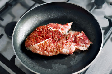 Beef  roast  in cast iron skillet , meat just added to hot oil , the upper sides are still red