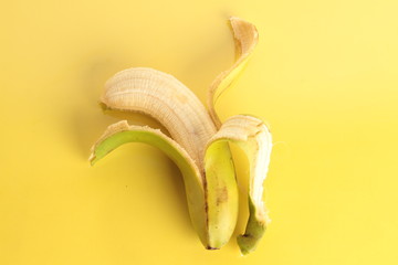 open banana on colorful background
