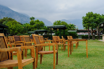 wooden chairs arranged as a cinema hall outdoors at a hotel in Turkey