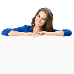 Beautiful young woman showing blank signboard