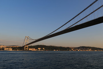 Fototapeta na wymiar Bosporus Bridge in the sunset. View from Bosporus Strait