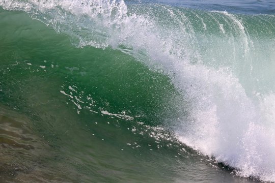 Close Up Of A Green Blue Wave Curling In The Ocean 