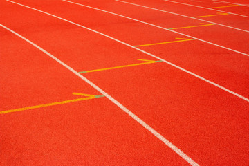Fototapeta premium Red running track Synthetic rubber on the athletic stadium.