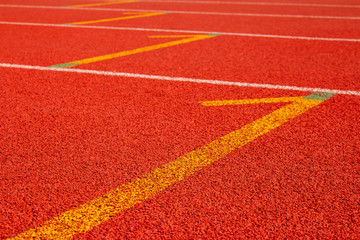 Red running track Synthetic rubber on the athletic stadium.