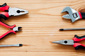Hand tools on wooden background. Different depth of field. Hand tools are located so that there is a place for the inscription.